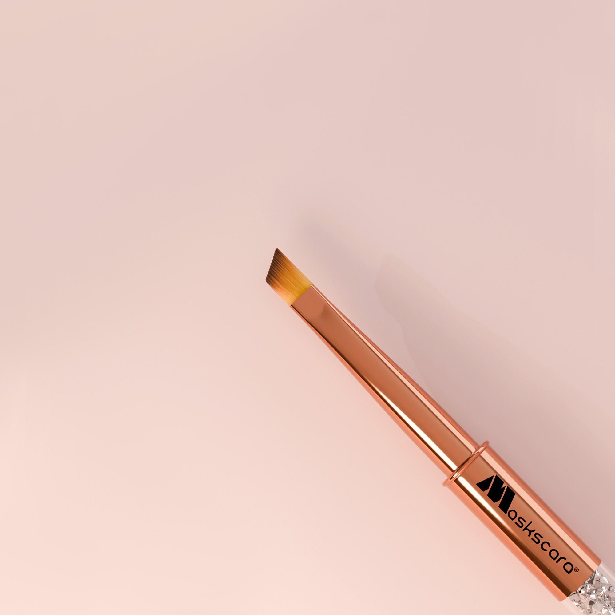<img scr = “Maskscara Rose Gold Smile Line Brush.jpg” alt = “Rose Gold smile line nail art brush by the brand Maskscara”>