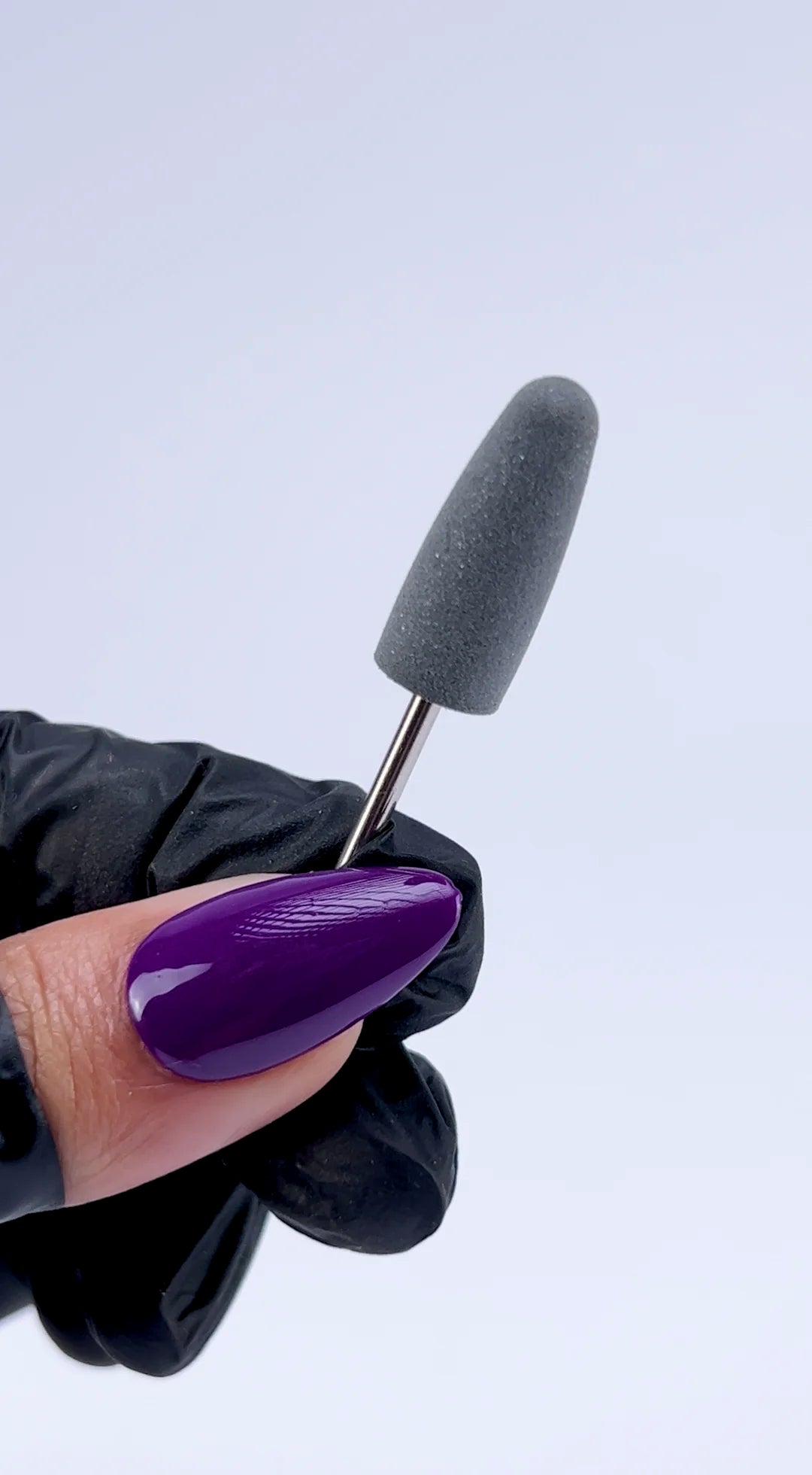 <img src="website-video-black-silicone-e-file-bit-#180-compressed.mp4" alt="technician using foam nail drill polishing bit to smooth acrylic nails during manicure">