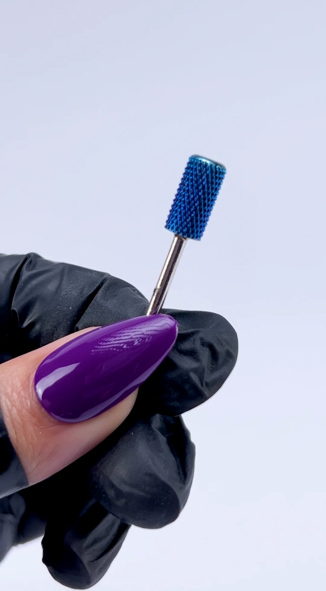 <img src="website-video-blue-carbide-e-file-bit-332-large-barrel-compressed.mp4" alt="technician using nail carbide drill bit during manicure">